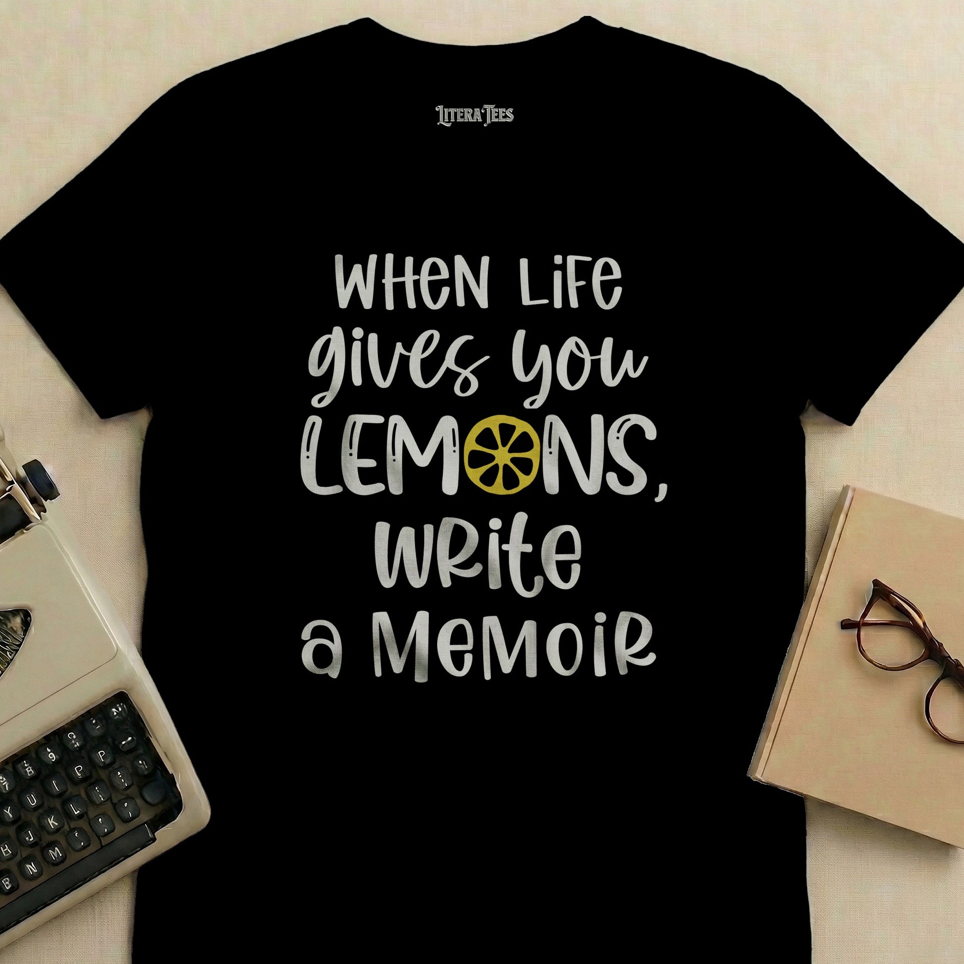 T-shirt with "When life gives you lemons, write a memoir" text and a lemon.