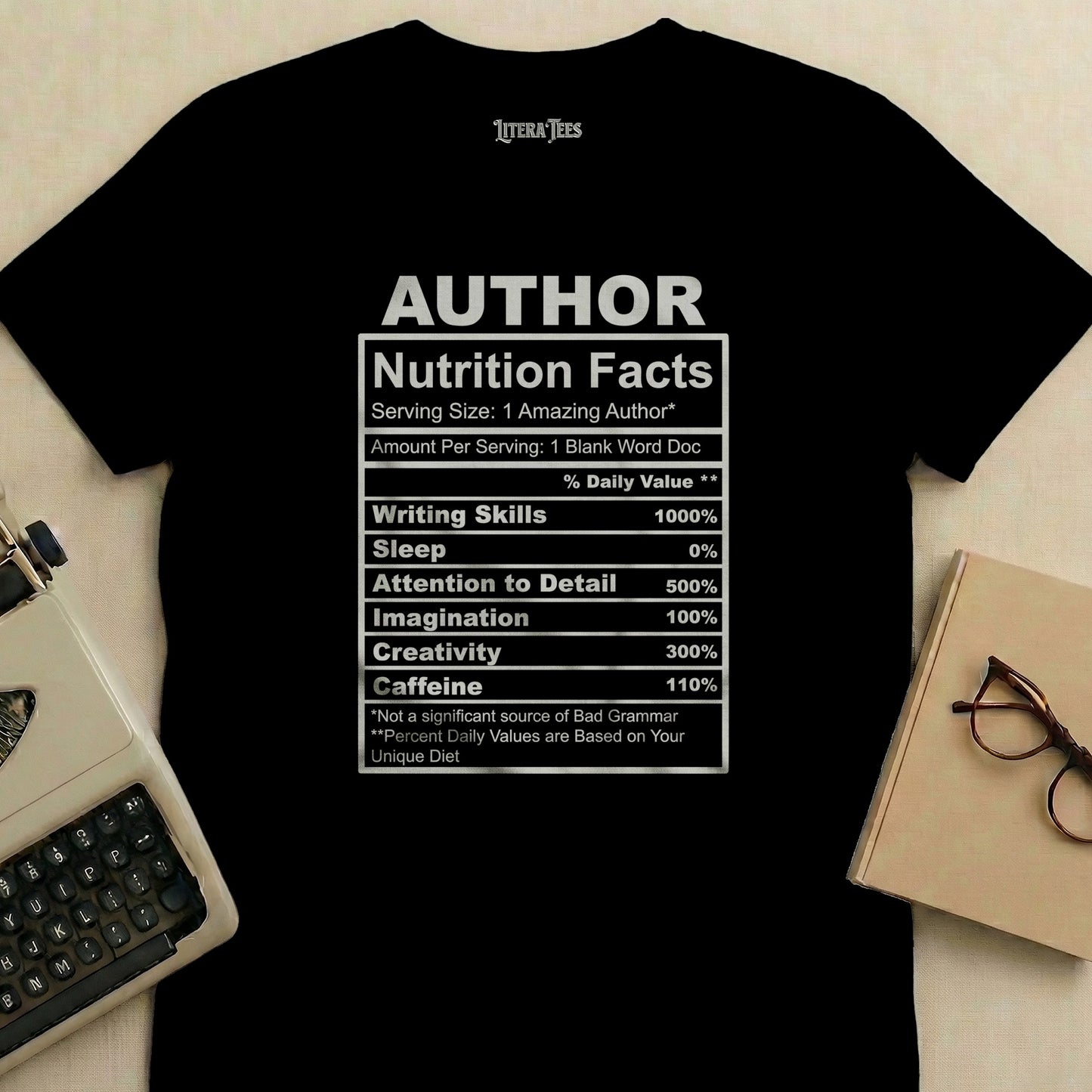 Black t-shirt with "Author Nutrition Facts" label detailing writing skills, sleep, attention to detail, imagination, creativity, and caffeine.