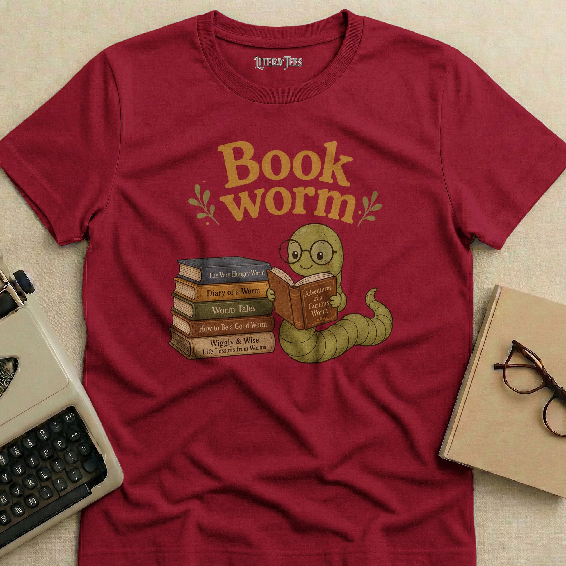 Maroon t-shirt with "Book worm" text and a worm reading books.