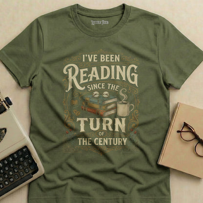 Olive green t-shirt with text "I've Been Reading Since The Turn Of The Century".